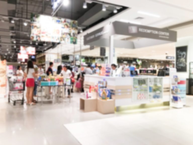 Abstract blur supermarket retail and shopping mall interior for background